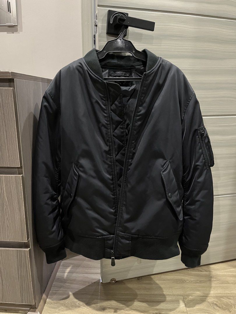 Uniqlo Blouson (Category: Coats, Jackets and Outerwear) located in Cavite. Submitted by askingryan (Listing ID 1470312449, Image 2). Description: - Brand: Uniqlo - Style: Bomber Blouson / Jacket - Color: Black - Size: L - Condition: Excellent / Well-maintained - Features: Durable nylon shell, comfortable quilted inner lining, utility pocket on the left sleeve, sturdy front zipper, and secure snap-button pockets - Perfect for daily wear, travel, o