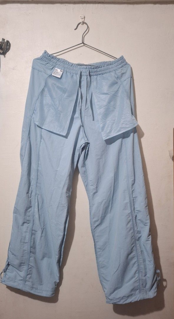 Uniqlo Light Blue Nylon Pants Size L (Category: Trousers) located in Manila. Submitted by annasigrid33015 (Listing ID 1470276521, Image 3). Description: - Brand: Uniqlo - Item: Nylon Pants - Color: Light Blue - Size: L (Waist: 69-75cm, Hips: 94-100cm) - Waistband: Elastic with adjustable drawstring - Pockets: Functional mesh pockets - Lining: Comfortable inner mesh lining - Material: Lightweight and breathable - Ideal for: Casual wear and outdoor