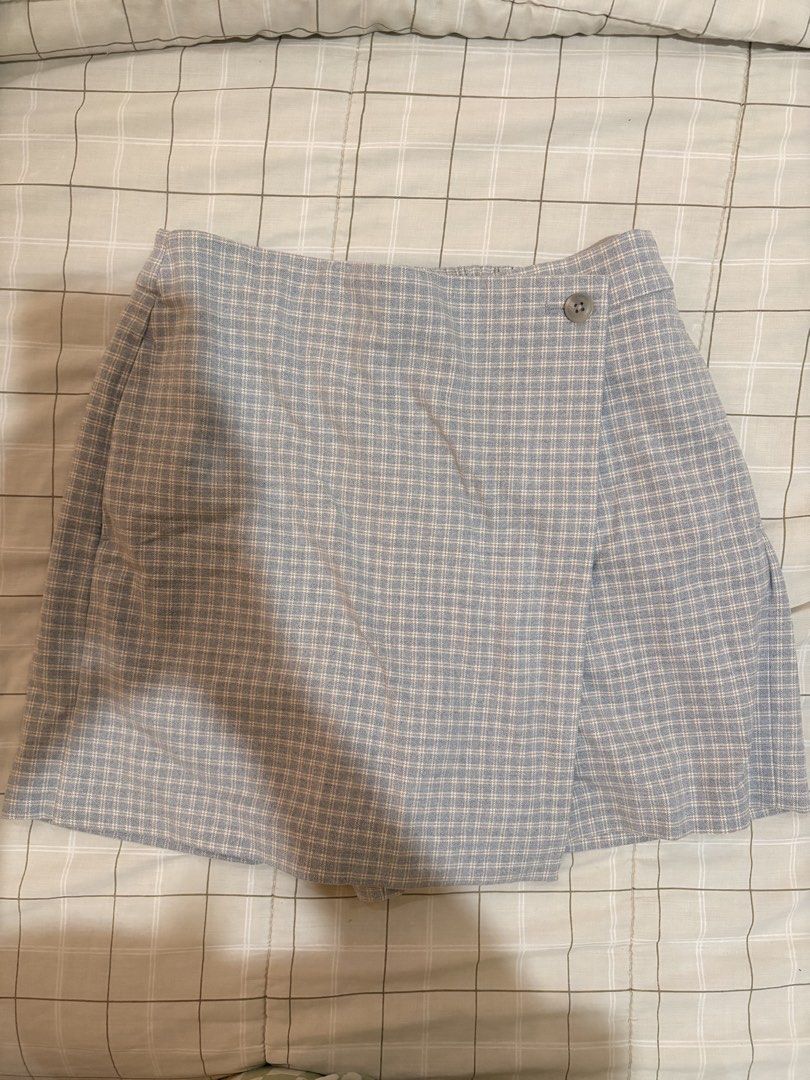 Uniqlo Plaid Wrap Skort (Category: Skirts) located in Dasmarinas. Submitted by littleczarmer (Listing ID 1470279017, Image 1). Description: - Brand: Uniqlo - worn once - Item: Blue/greyish plaid wrap skort - Size: M (Fits waist 63-69cm, hip 88-94cm) - Design: Chic wrap skirt look with built-in shorts for comfort and practicality - Closure & Fit: Side button closure with an elastic waistband at the back - Material: 68% polyester, 30% rayon, 2% spa