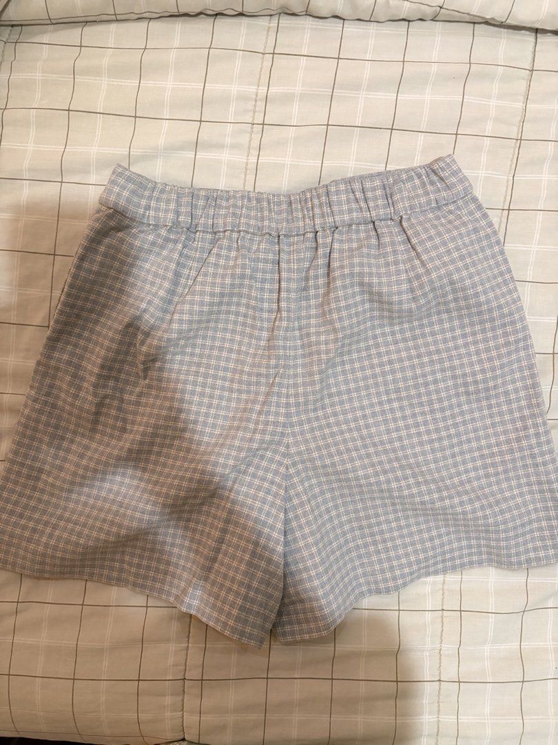 Uniqlo Plaid Wrap Skort (Category: Skirts) located in Dasmarinas. Submitted by littleczarmer (Listing ID 1470279017, Image 3). Description: - Brand: Uniqlo - worn once - Item: Blue/greyish plaid wrap skort - Size: M (Fits waist 63-69cm, hip 88-94cm) - Design: Chic wrap skirt look with built-in shorts for comfort and practicality - Closure & Fit: Side button closure with an elastic waistband at the back - Material: 68% polyester, 30% rayon, 2% spa