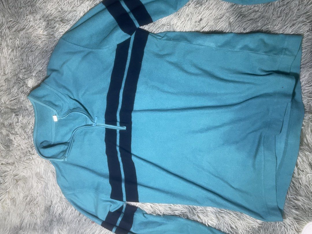 Uniqlo Quarter Zip Fleece Pullover Blue Size M (Category: Coats, Jackets and Outerwear) located in Manila. Submitted by kyyyyyih (Listing ID 1470287822, Image 3). Description: - Brand: Uniqlo - Item: Light blue fleece pullover with quarter-zip high neck - Details: Dark blue horizontal chest and matching arm stripes - Size: Medium - Fabric: Soft and cozy fleece.