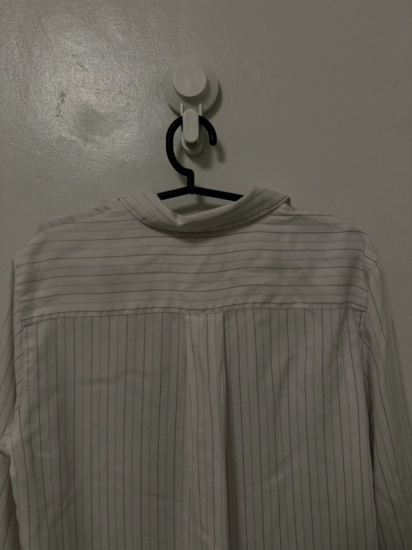 Uniqlo Striped Long Sleeve Button-Down Shirt (Category: Longsleeves) located in Makati City. Submitted by kaideclutter (Listing ID 1470338840, Image 3). Description: Uniqlo White with Thin Stripes Long Sleeves Brand: Uniqlo Size: Small - Can fit petite to small frame girlies Color: White Condition: ⭐️⭐️⭐️⭐️⭐️ Price: 250.00 RFS: Does not fit me anymore.