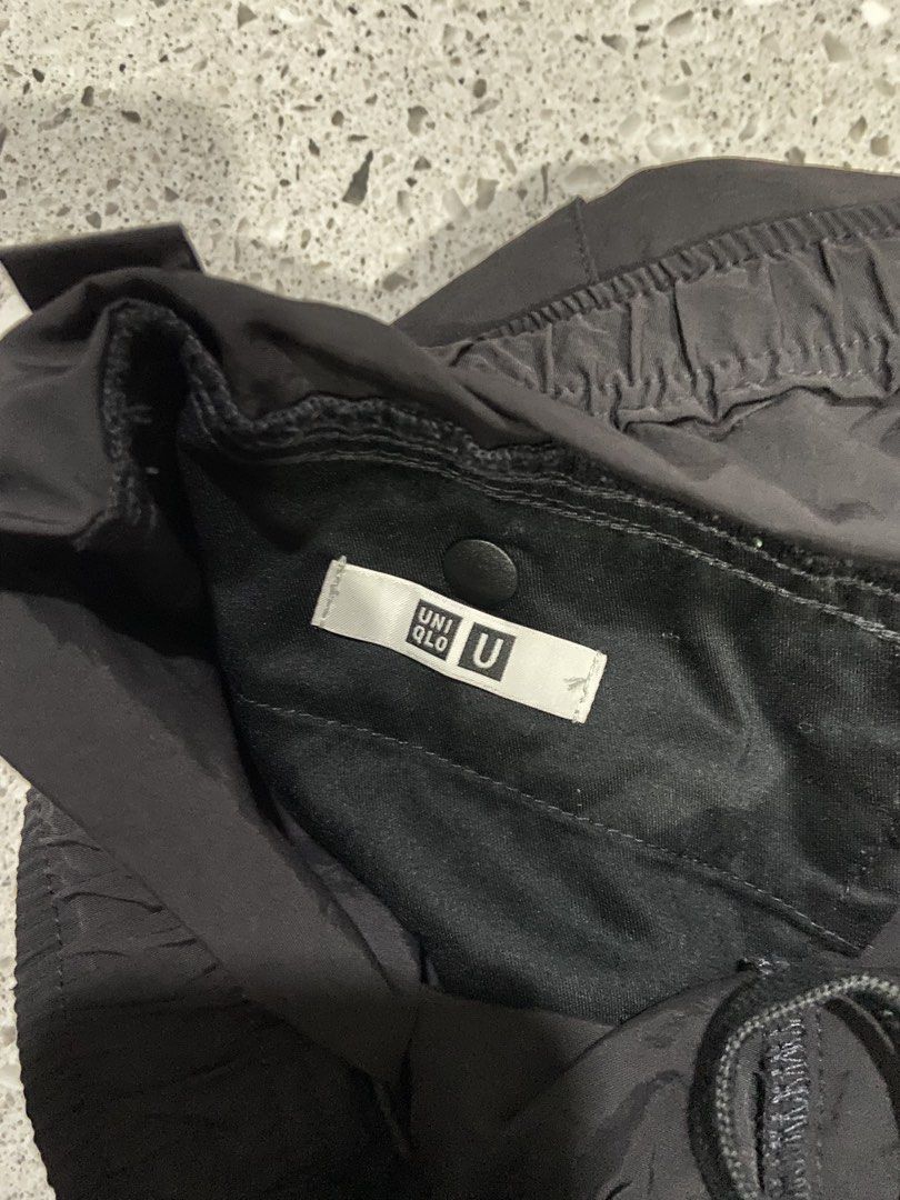 Uniqlo U Black Cargo Shorts Size M (Category: Shorts) located in Calumpit. Submitted by Ketchi (Listing ID 1470263790, Image 2). Description: - Brand: Uniqlo U - Color: Classic Black - Size: M (fits waist 76-84cm) - Material: Lightweight nylon blend - Design: Utility style with large side cargo pockets - Waistband: Elastic with drawstring and button closure - Condition: Clean with tags intact inside - Style: Great everyday casual streetwear.
