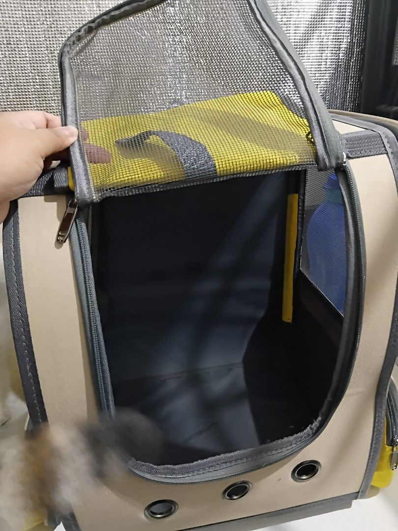 Upaw Pet Carrier Backpack Yellow XL (Category: Backpacks) located in Mandaluyong City. Submitted by cheshireshoppe (Listing ID 1470100942, Image 2). Description: More photos available upon request - Brand/Model: Upaw Pet Carrier Backpack XL - Colorway: Stylish khaki with bright yellow accents - Dual-Purpose Front: Solid yellow privacy panel that rolls up to reveal a breathable mesh window - Ventilation: 3 metal grommets near the base for steady a