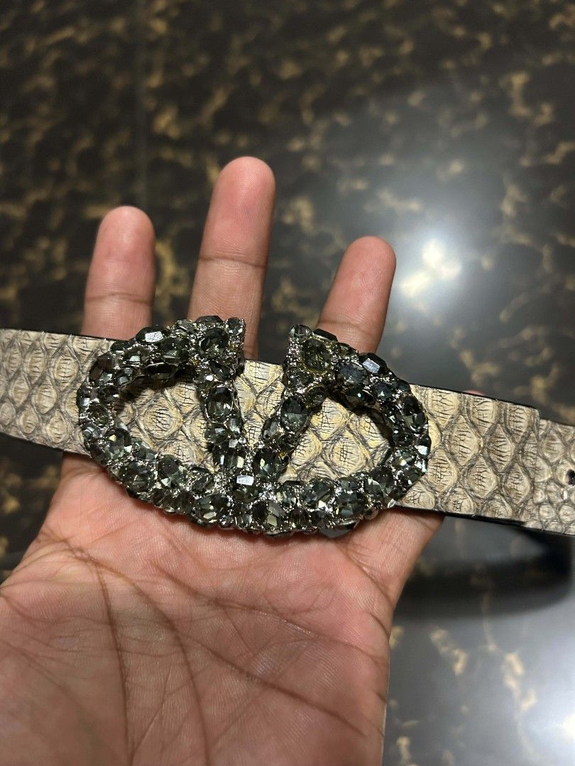 Valentino Garavani Crystal VLogo Python Print Belt Size 80/32 (Category: Belts) located in Manila. Submitted by marjoriete27817 (Listing ID 1470310720, Image 3). Description: - Brand: Valentino Garavani - Material: Genuine leather with python snake print (beige and black tones) - Hardware: Gunmetal with large crystal-embellished VLogo buckle - Size: 80 / 32 (stamped on inner band) - Condition: Clean interior with clear brand stamp - Style: High-e