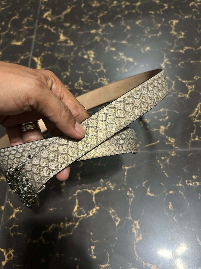 Valentino Garavani Crystal VLogo Python Print Belt Size 80/32 (Category: Belts) located in Manila. Submitted by marjoriete27817 (Listing ID 1470310720, Image 2). Description: - Brand: Valentino Garavani - Material: Genuine leather with python snake print (beige and black tones) - Hardware: Gunmetal with large crystal-embellished VLogo buckle - Size: 80 / 32 (stamped on inner band) - Condition: Clean interior with clear brand stamp - Style: High-e
