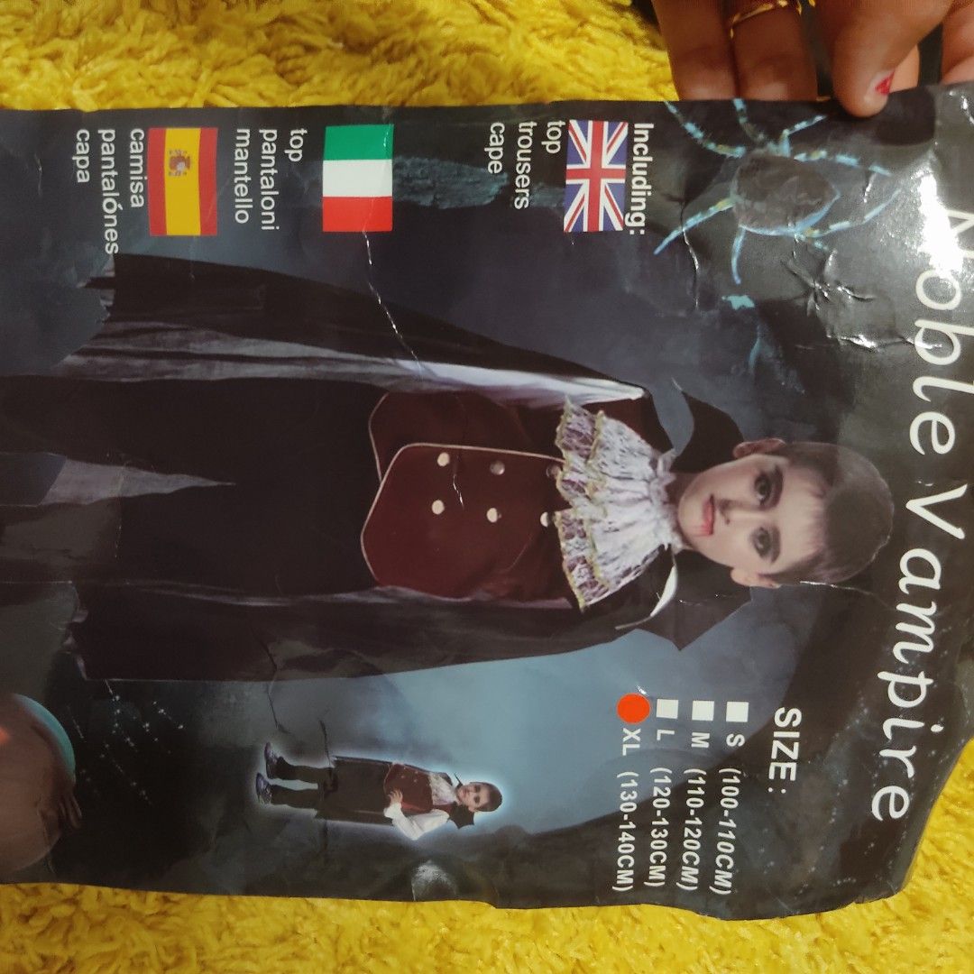 Vampire Halloween costume for kids (Category: Babies & Kids Fashion) located in Las Pinas. Submitted by minimy (Listing ID 1470144529, Image 1). Description: - Item: Kids Noble Vampire Costume Set - Size: XL (best for 130 to 140 cm height)it easily fit my 7;year old son though - Inclusions: Red velvet-look top with attached white sleeves and gold buttons, black trousers, black cape, and separate white lace collar piece - Packaging: Comes with ori