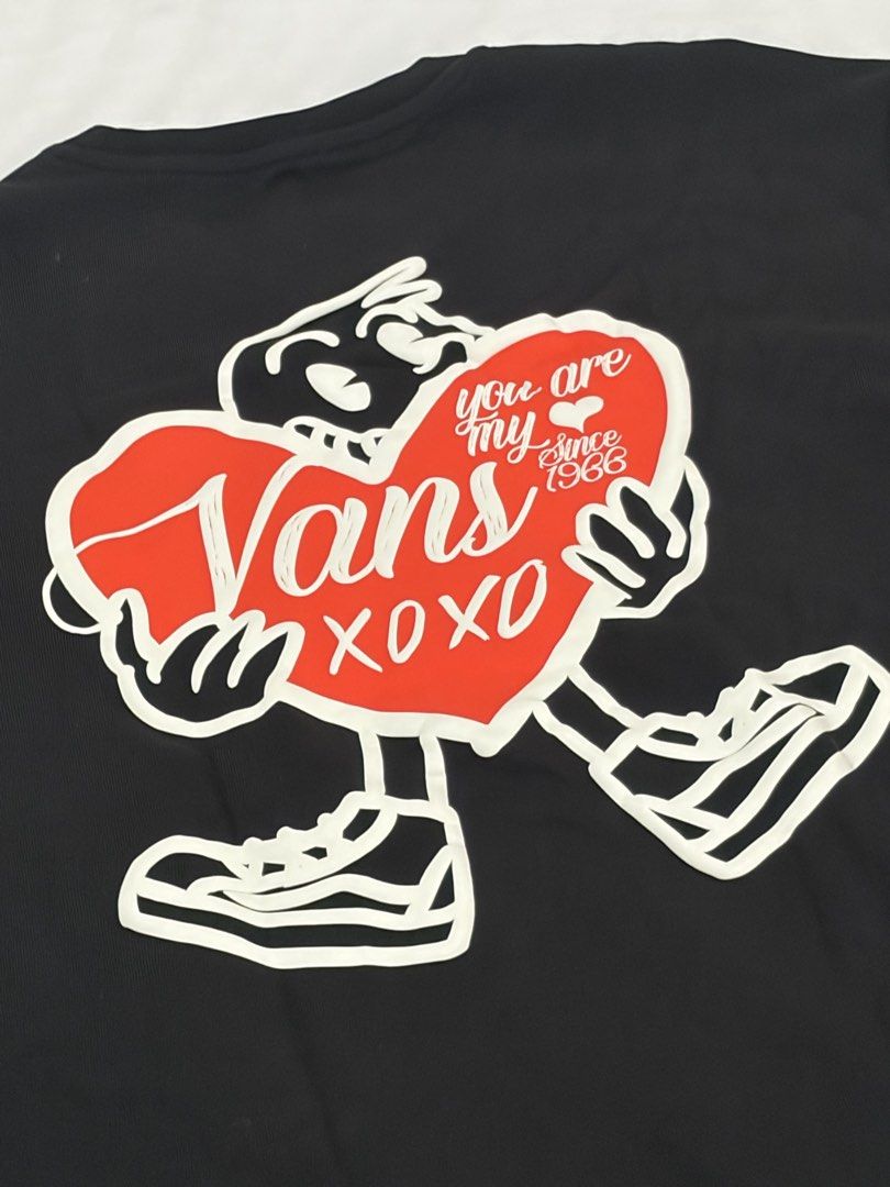 Vans Black Graphic Tee Relaxed Fit Small (Category: Tshirts & Polo Shirts ) located in Las Pinas. Submitted by thriftedfinds_ (Listing ID 1470311994, Image 2). Description: - Brand: Vans - Color: Black - Size: Small - Fit: Relaxed fit with short sleeves and crew neckline - Design: Small heart print on front left chest; large cartoon heart graphic with 'You are my since 1966' and 'XOXO' text on the back - Condition: Clean fabric with sharp, clear 