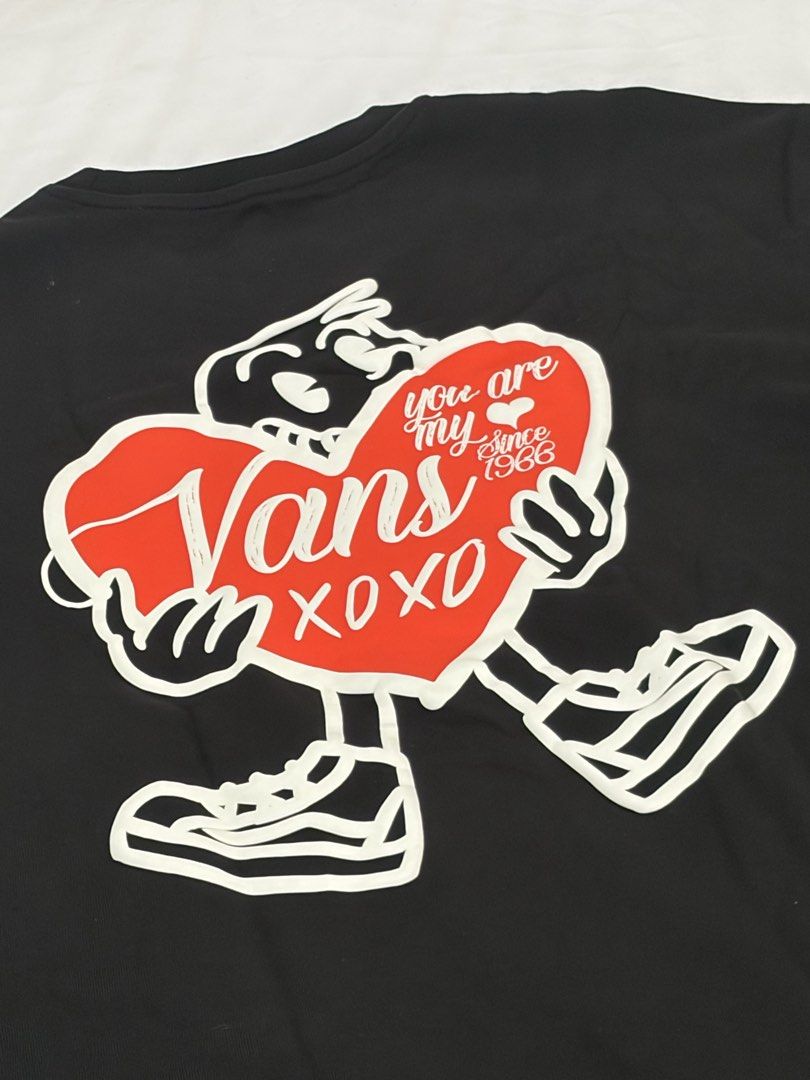 Vans Black Graphic Tee Relaxed Fit Small (Category: Tshirts & Polo Shirts ) located in Las Pinas. Submitted by thriftedfinds_ (Listing ID 1470311994, Image 3). Description: - Brand: Vans - Color: Black - Size: Small - Fit: Relaxed fit with short sleeves and crew neckline - Design: Small heart print on front left chest; large cartoon heart graphic with 'You are my since 1966' and 'XOXO' text on the back - Condition: Clean fabric with sharp, clear 