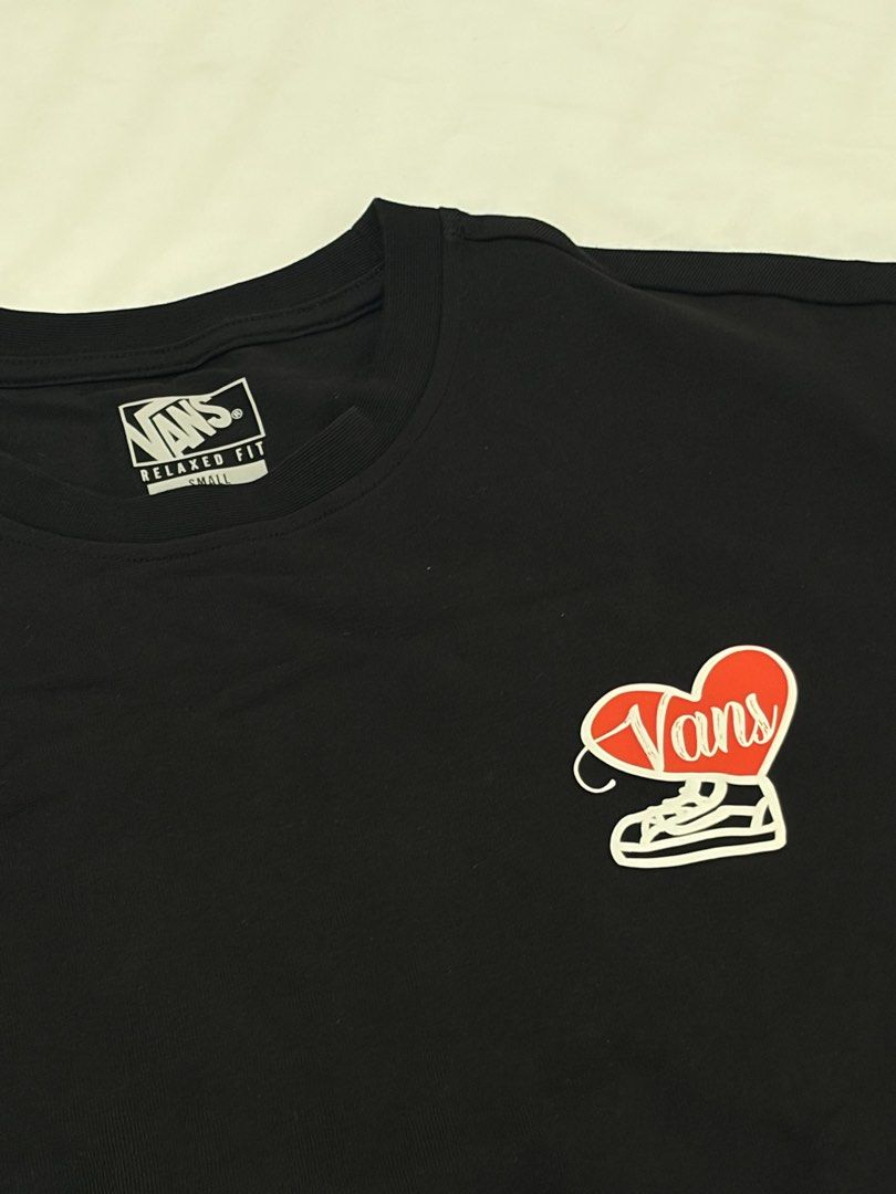 Vans Black Graphic Tee Relaxed Fit Small (Category: Tshirts & Polo Shirts ) located in Las Pinas. Submitted by thriftedfinds_ (Listing ID 1470311994, Image 1). Description: - Brand: Vans - Color: Black - Size: Small - Fit: Relaxed fit with short sleeves and crew neckline - Design: Small heart print on front left chest; large cartoon heart graphic with 'You are my since 1966' and 'XOXO' text on the back - Condition: Clean fabric with sharp, clear 