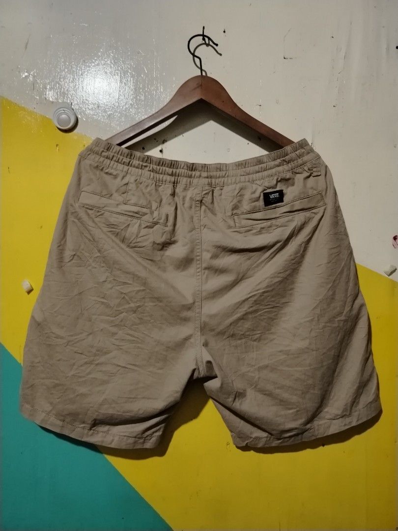 Vans Khaki Drawstring Shorts (Category: Shorts) located in Caloocan City. Submitted by vincefresn21903 (Listing ID 1470278248, Image 2). Description: - Brand: Vans - Color: Khaki - Style: Simple everyday casual wear - Waistband: Elastic with matching drawstring closure - Pockets: Two side pockets - Details: Small black Vans tag on the left hem - Material: Lightweight and comfortable fabric - Condition: Brand new/Mint.