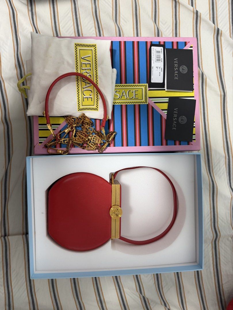 Versace Tribute Vanity Case Bag in Red (Category: Luxury Bags & Wallets) located in Iloilo. Submitted by lorenzoivan (Listing ID 1470266608, Image 1). Description: RARE ‼️ Versace Tribute Vanity Case Bag in Red -₱40,000 LEGIT / AUTHENTIC: Full Inclusion Like New Flaws: dirty dustbag side of handle is a bit out of shape Asking for ₱40,000 (NEGOTIABLE) DM for more inquiries and more pics.