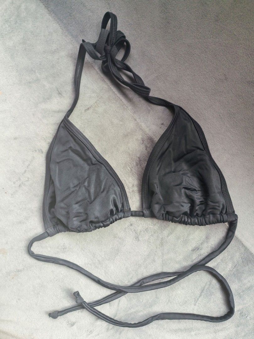 Victoria's Secret Black Minimalist String Bikini Top (Category: Bikinis & Swimsuits) located in Taguig. Submitted by iggysclutter (Listing ID 1470250665, Image 1). Description: - Brand: Victoria's Secret - Style: Classic triangle bikini top with gathered fabric detail - Straps: Adjustable string ties behind neck and back - Color: Black - Origin: Made in Sri Lanka - Condition: Clean and ready to wear.