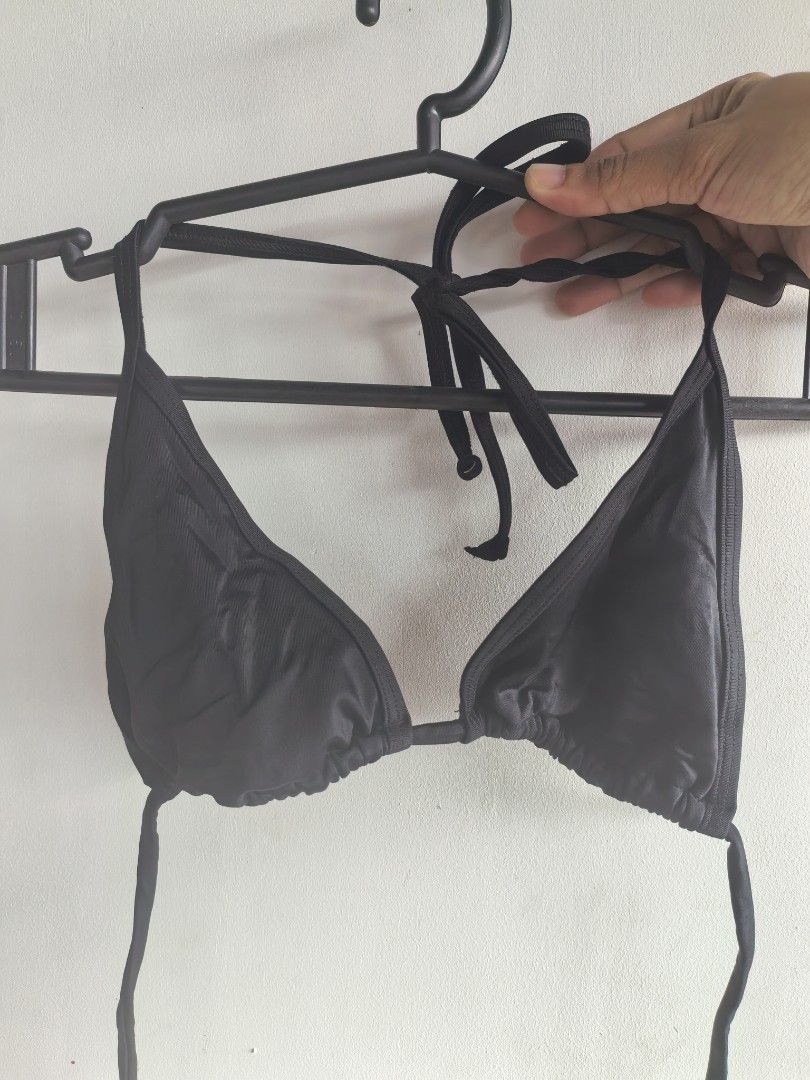 Victoria's Secret Black Minimalist String Bikini Top (Category: Bikinis & Swimsuits) located in Taguig. Submitted by iggysclutter (Listing ID 1470250665, Image 2). Description: - Brand: Victoria's Secret - Style: Classic triangle bikini top with gathered fabric detail - Straps: Adjustable string ties behind neck and back - Color: Black - Origin: Made in Sri Lanka - Condition: Clean and ready to wear.
