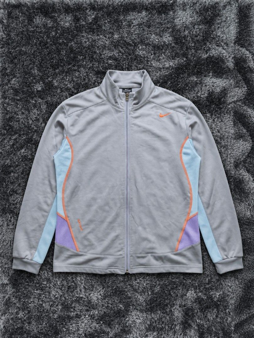 Vinrage Nike Clima-FIT Grey Track Jacket (Category: Coats, Jackets and Outerwear) located in Imus. Submitted by angworkinginamo (Listing ID 1470319201, Image 1). Description: Authentic Vintage Nike Clima-Fit Track Jacket Selling this legit vintage Nike windbreaker/track jacket from the early 2000s. Very unique purple, gray, and orange colorway. Perfect for cold weather, motor riding, or casual streetwear outfits. • Size: Large on tag •Dime: 22L x