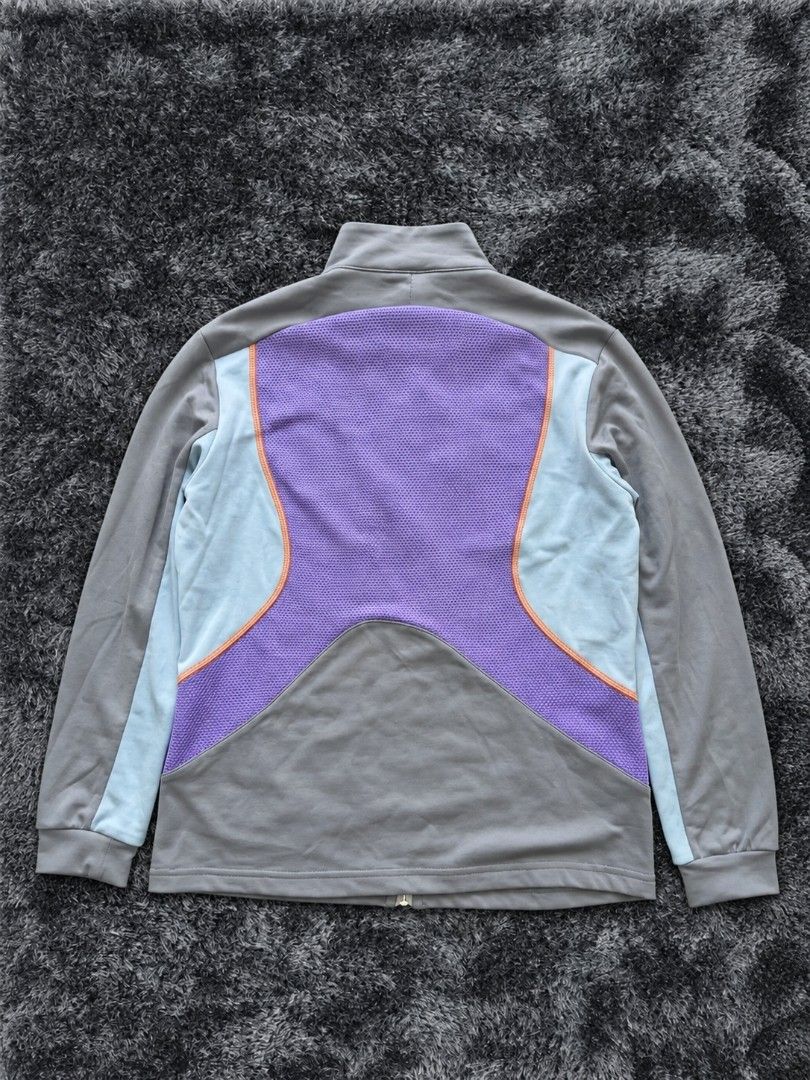 Vinrage Nike Clima-FIT Grey Track Jacket (Category: Coats, Jackets and Outerwear) located in Imus. Submitted by angworkinginamo (Listing ID 1470319201, Image 2). Description: Authentic Vintage Nike Clima-Fit Track Jacket Selling this legit vintage Nike windbreaker/track jacket from the early 2000s. Very unique purple, gray, and orange colorway. Perfect for cold weather, motor riding, or casual streetwear outfits. • Size: Large on tag •Dime: 22L x