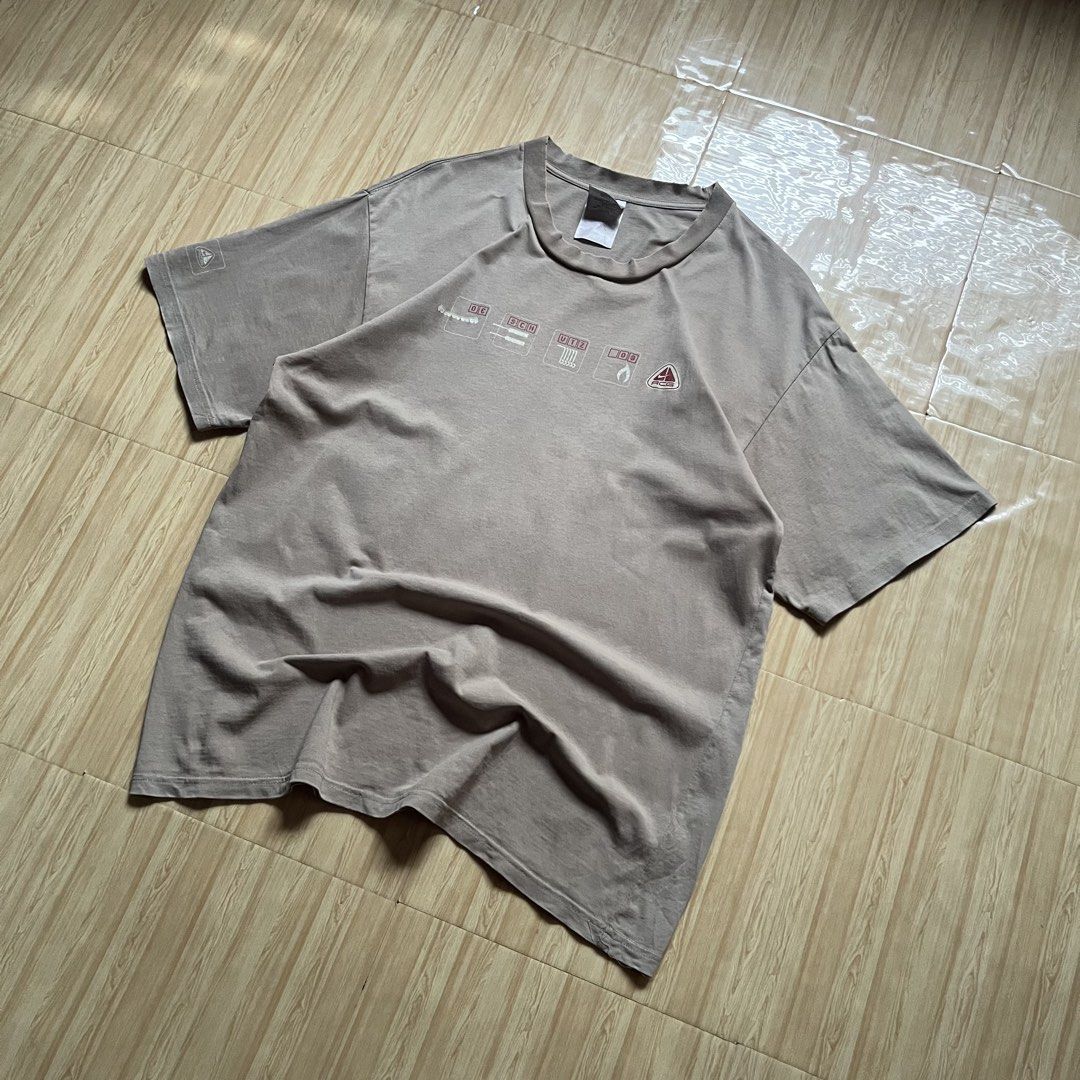 Vintage 00s Nike ACG Technical Icon Tee (Category: Tshirts & Polo Shirts ) located in Hagonoy. Submitted by ianthrift_ph (Listing ID 1470248485, Image 3). Description: complete tags/authentic size large on tag 21.3 width, 31 length good condition color rate 8/10 issue: bacon and distressing neck (see last pic).