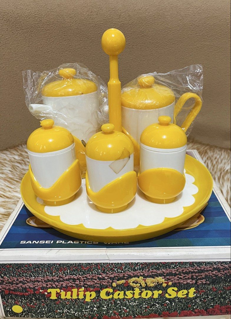 vintage 1970s Sansei Plastic Tulip Caster Set (Category: Vintage Collectibles) located in Quezon City. Submitted by sissymissy1527 (Listing ID 1470320925, Image 2). Description: This is a set of cute tulip-shaped spice containers and a stand. This is a 6-piece set including a soy sauce dispenser, a sauce dispenser, salt and pepper dispensers, a mustard dispenser, and a stand. Size Stand diameter: approx. 22 cm, height: approx. 18 cm.