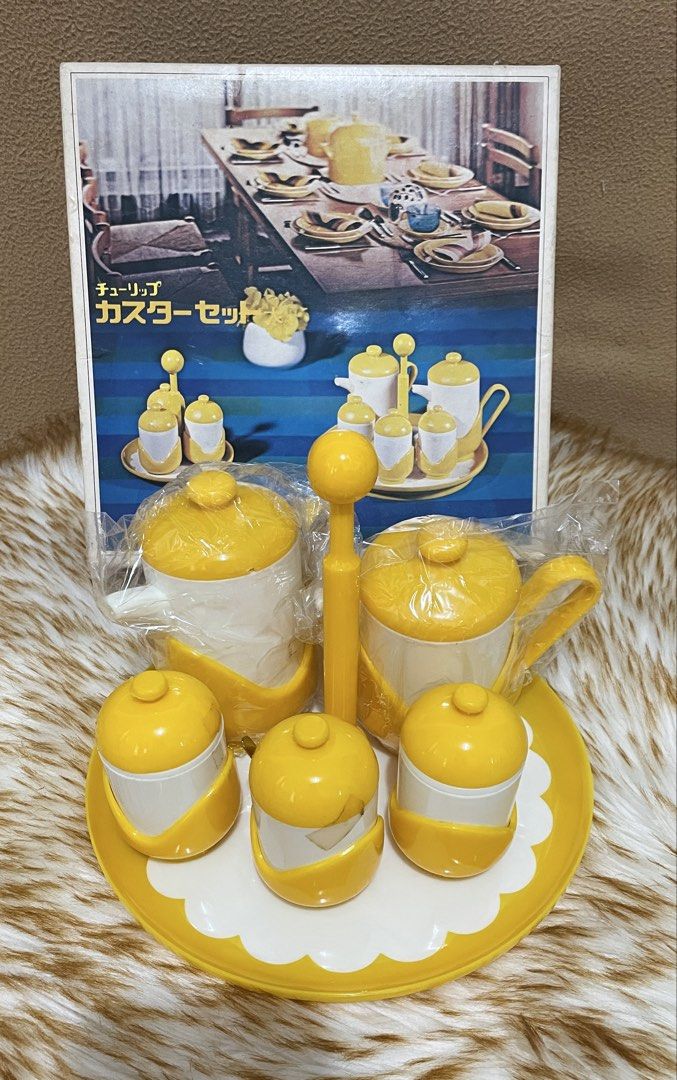 vintage 1970s Sansei Plastic Tulip Caster Set (Category: Vintage Collectibles) located in Quezon City. Submitted by sissymissy1527 (Listing ID 1470320925, Image 1). Description: This is a set of cute tulip-shaped spice containers and a stand. This is a 6-piece set including a soy sauce dispenser, a sauce dispenser, salt and pepper dispensers, a mustard dispenser, and a stand. Size Stand diameter: approx. 22 cm, height: approx. 18 cm.
