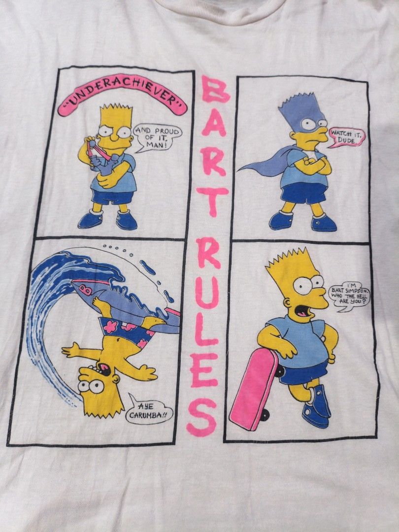 Vintage Bart Rules The Simpsons Comic Panel T-Shirt (Category: Tshirts & Polo Shirts ) located in Narvacan. Submitted by picky_looter (Listing ID 1470302647, Image 2). Description: - Color: Classic white - Size: XL - Design: Four-panel Bart Simpson comic print with 'Bart Rules', 'Underachiever', and 'Aye Carumba' text - Details: Short sleeves, crew neck, plain back - Condition: Natural fading for a vintage cartoon merch vibe.