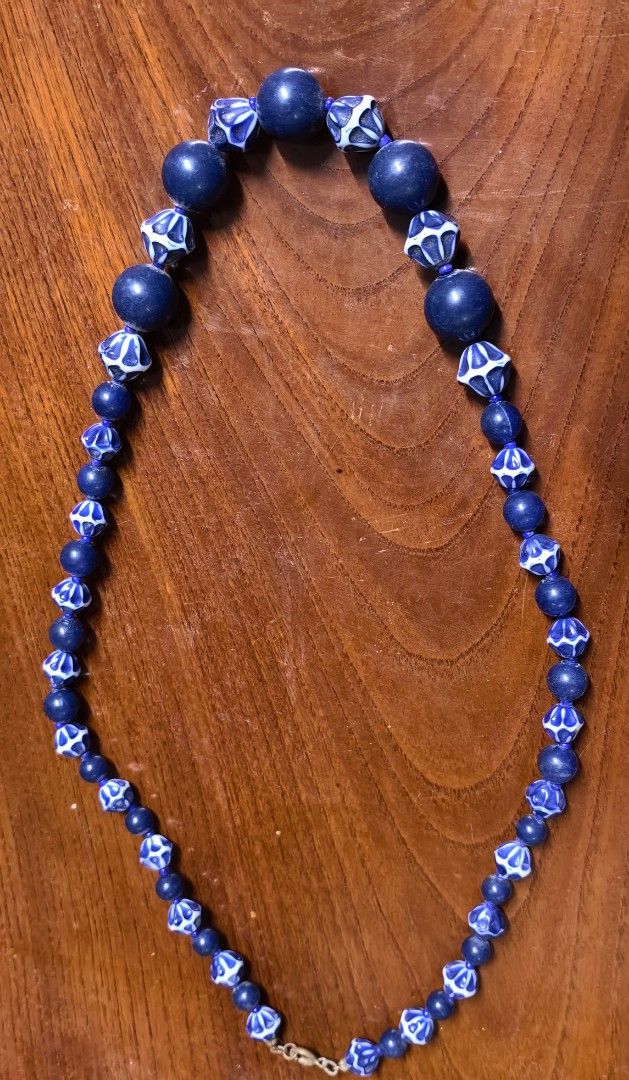 Vintage Blue and White Patterned Bead Statement Necklace (Category: Necklaces) located in Rizal. Submitted by gkstcenit (Listing ID 1470343892, Image 1). Description: - Vintage statement necklace with a chunky collarbone design - Alternating solid dark blue round beads and intricate geometric patterned faceted beads - Measures roughly 11 inches long when laid flat - Features a secure gold-tone spring ring clasp closure - Perfect accessory to inst