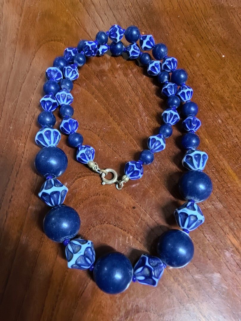 Vintage Blue and White Patterned Bead Statement Necklace (Category: Necklaces) located in Rizal. Submitted by gkstcenit (Listing ID 1470343892, Image 3). Description: - Vintage statement necklace with a chunky collarbone design - Alternating solid dark blue round beads and intricate geometric patterned faceted beads - Measures roughly 11 inches long when laid flat - Features a secure gold-tone spring ring clasp closure - Perfect accessory to inst