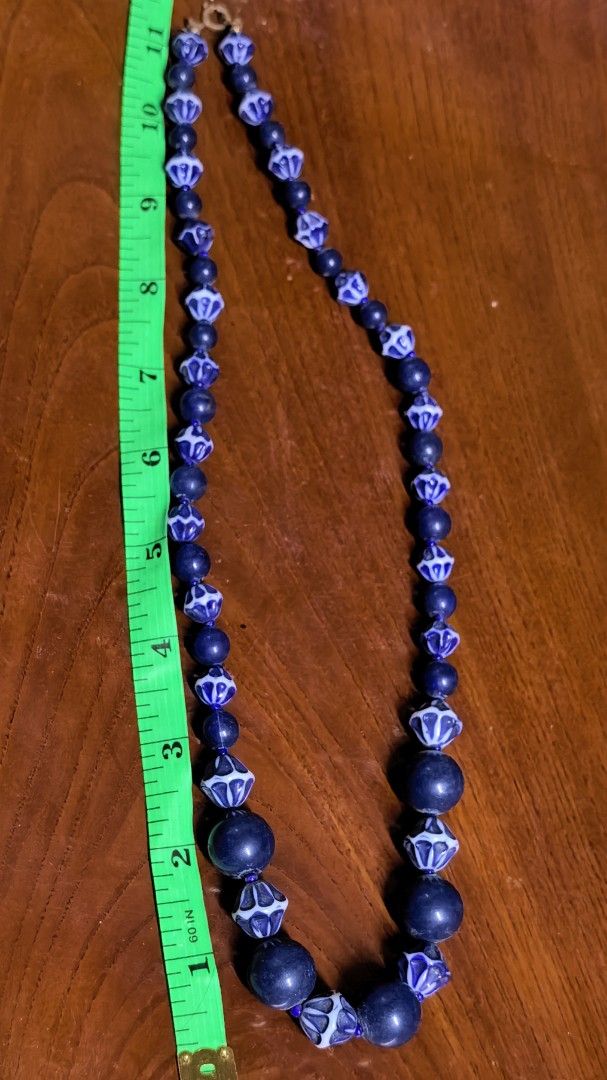 Vintage Blue and White Patterned Bead Statement Necklace (Category: Necklaces) located in Rizal. Submitted by gkstcenit (Listing ID 1470343892, Image 2). Description: - Vintage statement necklace with a chunky collarbone design - Alternating solid dark blue round beads and intricate geometric patterned faceted beads - Measures roughly 11 inches long when laid flat - Features a secure gold-tone spring ring clasp closure - Perfect accessory to inst