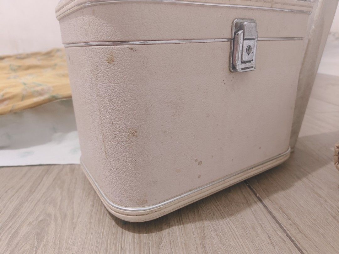 Vintage Charm Pink Makeup Vanity Case Train Case (Category: Purses & Pouches) located in Bulacan. Submitted by babz30261 (Listing ID 1470275566, Image 3). Description: - Style: Vintage pink textured makeup case - Features: Built-in mirror, top handle, front pocket, and silver-tone hardware latch - Condition: Exterior has marks and scuffs; interior shows discoloration and staining from age and use - Ideal for: Retro lovers, vanity organization, or