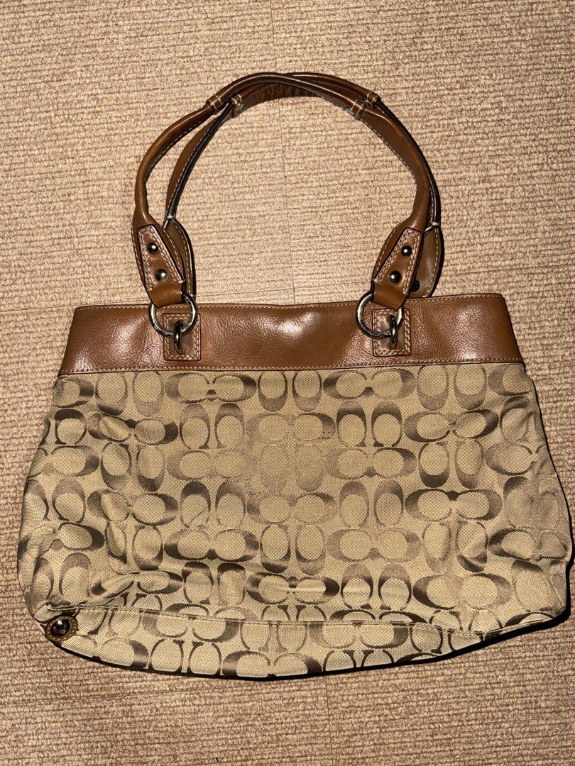 Vintage Coach Bag (Category: Luxury Bags & Wallets) located in Quezon. Submitted by kuromi.bow (Listing ID 1470313543, Image 3). Description: Coach Penelope Signature “C” Shoulder Purse Handbag F15533 Vtg ‘93, Brown leather, jacquard fabric, silver metal, red interior - Condition 9/10, just needs cleaning - Delivery or meetup around qc - Authentic from Korea - Price is negotiable .
