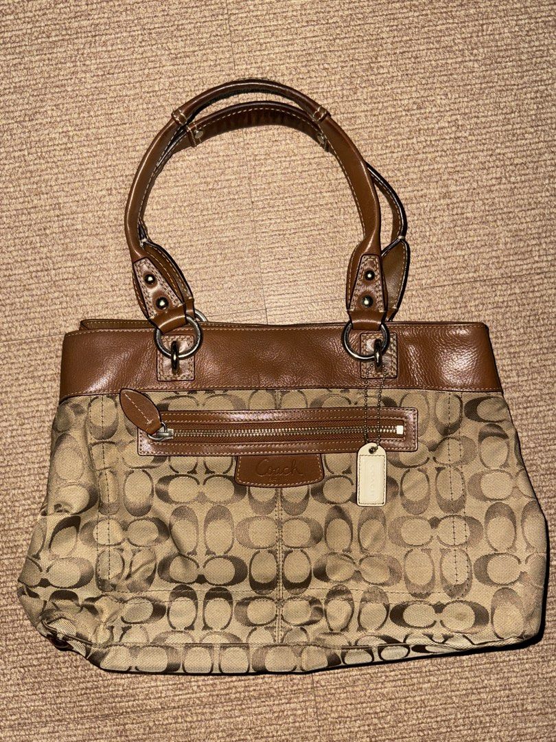 Vintage Coach Bag (Category: Luxury Bags & Wallets) located in Quezon. Submitted by kuromi.bow (Listing ID 1470313543, Image 1). Description: Coach Penelope Signature “C” Shoulder Purse Handbag F15533 Vtg ‘93, Brown leather, jacquard fabric, silver metal, red interior - Condition 9/10, just needs cleaning - Delivery or meetup around qc - Authentic from Korea - Price is negotiable .