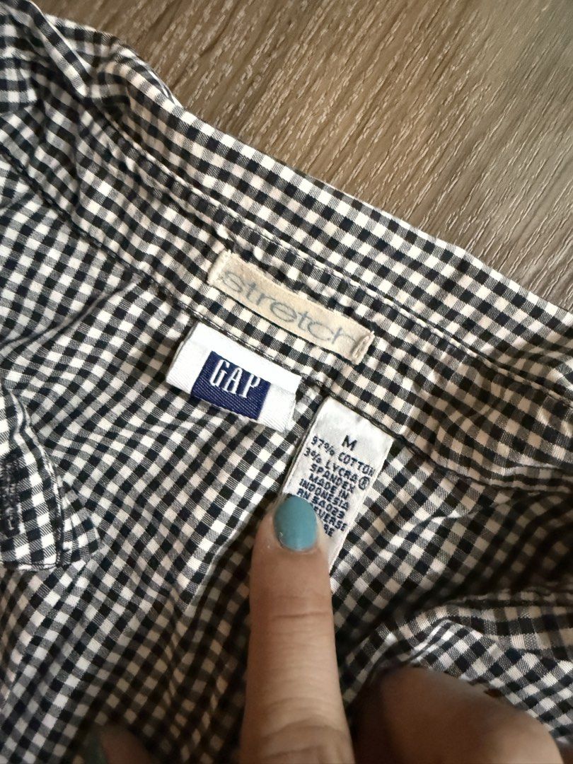 Vintage GAP Y2K Gingham Check Button-Down Shirt (Size M) (Category: Others Tops) located in Manila. Submitted by surprisesupplies (Listing ID 1470216826, Image 2). Description: A timeless Y2K staple featuring a black & white gingham pattern with comfortable 3/4 sleeves and standard stretch cotton. Perfect for preppy, office siren, or casual chic looks! Brand: GAP (Vintage late 90s / early 2000s) Size on Tag: Medium (M) Material: 97% Cotton, 3% Ly