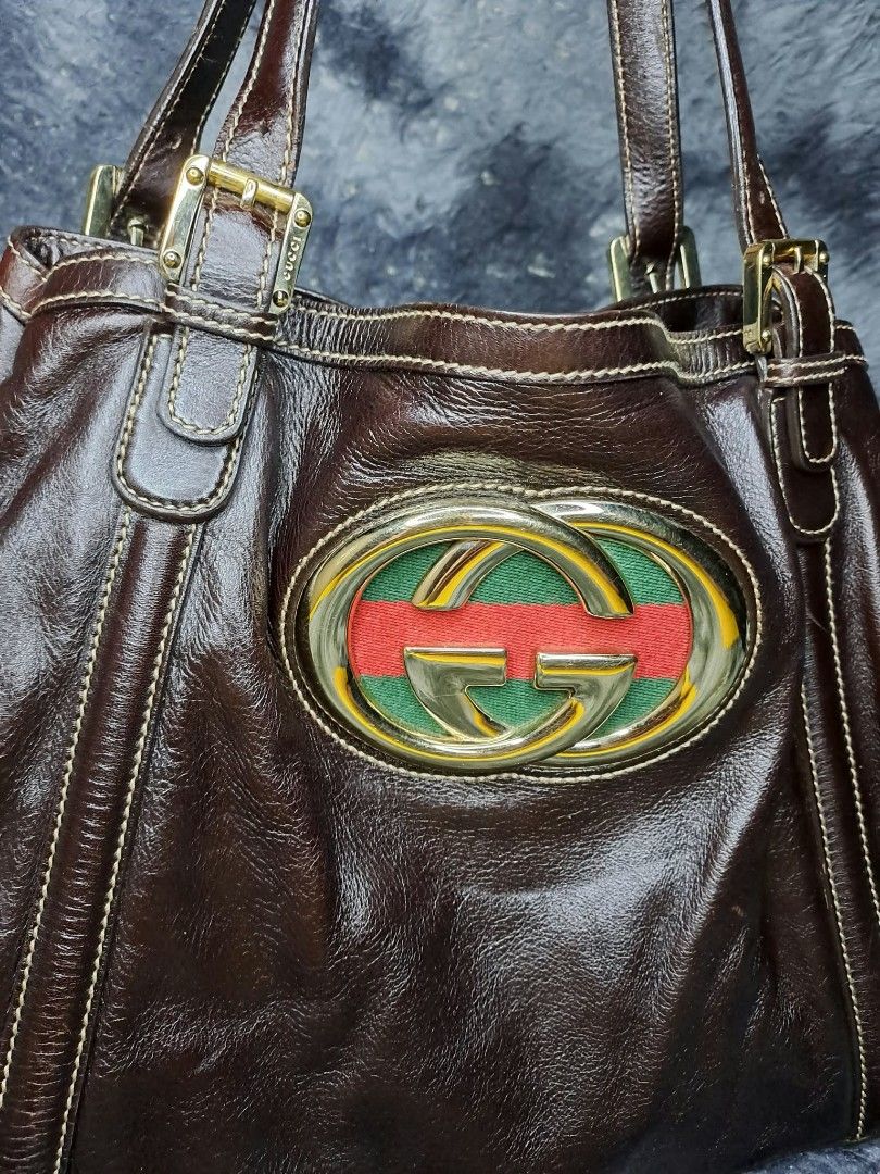 Vintage Gucci Web Britt Tote Bag (Category: Luxury Bags & Wallets) located in Quezon City. Submitted by yaseen73 (Listing ID 1470344099, Image 2). Description: 🔥Pre - Owned / Declutter🔥 Vintage Gucci Britt Tote Bag Mid - Early 2000's ✔️ Prestine Condition ✔️ With Minor Marks of Usage ✔️ I Bought it in Switzerland ✔️ Not Longer Needed Specific Details : ✔️ Line / Collection : Gucci Britt ✔️ Material : Supple Grained Dark Brown / Chocolate Calfsk