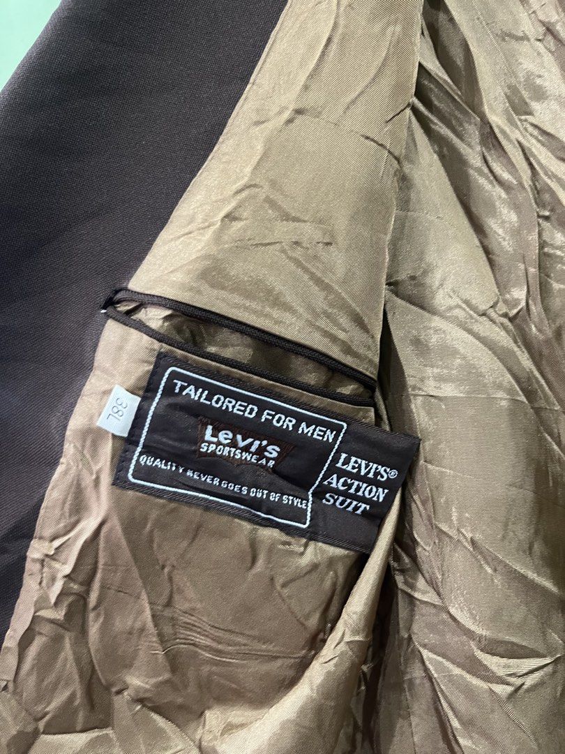 Vintage Levi's Action Suit Jacket Brown 38L (Category: Coats, Jackets and Outerwear) located in Dasmarinas. Submitted by thriftedbygii (Listing ID 1470165632, Image 2). Description: - Brand: Levi's Action Suit - Color: Brown - Size: 38L (tailored fit) - Closure: Classic two-button front - Cuffs: Button cuffs on sleeves - Pockets: Hip flap pockets and single chest pocket - Lining: Beige satin-like inner lining with Levi's Sportswear woven tag - Co
