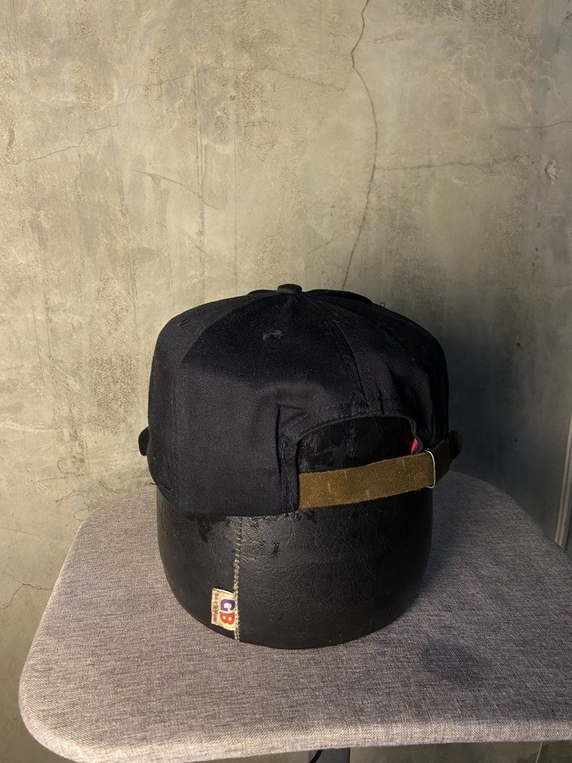 Vintage Marlboro Racing 95 Cap Black (Category: Caps & Hats) located in Manila. Submitted by thriftnijheero (Listing ID 1470169055, Image 2). Description: - Classic black baseball cap with embroidered Marlboro Racing 95 speedometer graphic - Pre-owned condition with an authentic retro motorsports vibe - Adjustable back strap with a secure metal clasp - Contrast red interior sweatband - 100% cotton material, made in Taiwan.