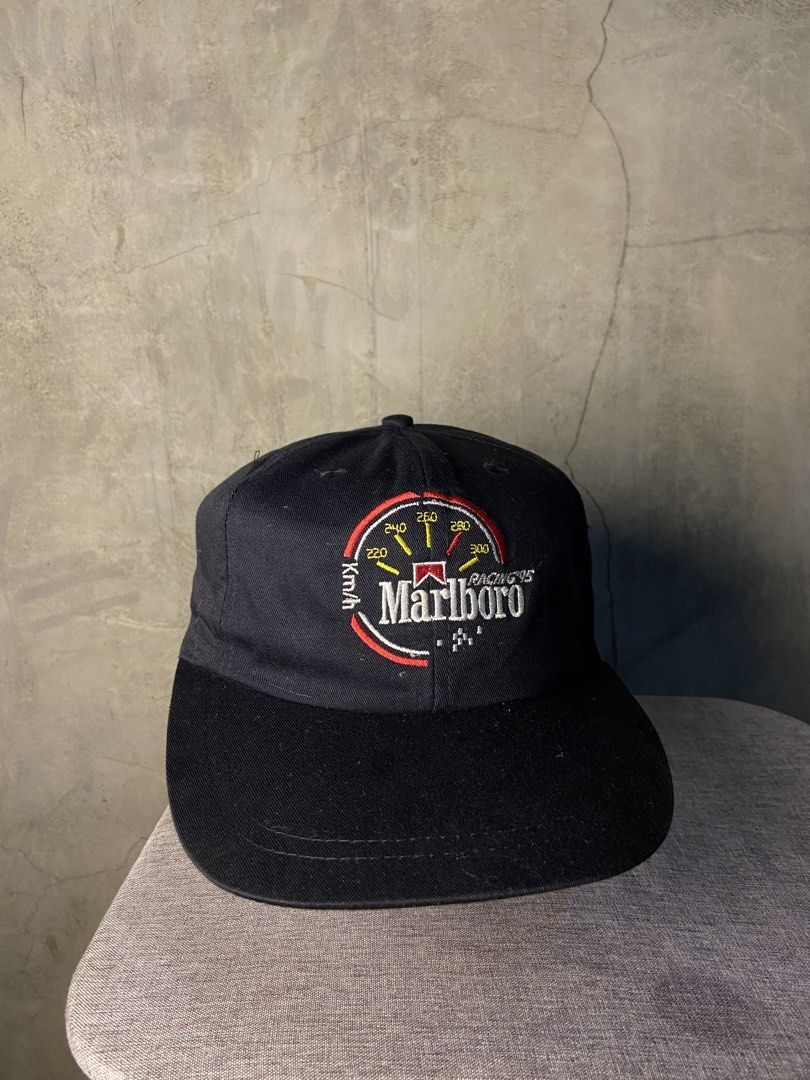 Vintage Marlboro Racing 95 Cap Black (Category: Caps & Hats) located in Manila. Submitted by thriftnijheero (Listing ID 1470169055, Image 1). Description: - Classic black baseball cap with embroidered Marlboro Racing 95 speedometer graphic - Pre-owned condition with an authentic retro motorsports vibe - Adjustable back strap with a secure metal clasp - Contrast red interior sweatband - 100% cotton material, made in Taiwan.