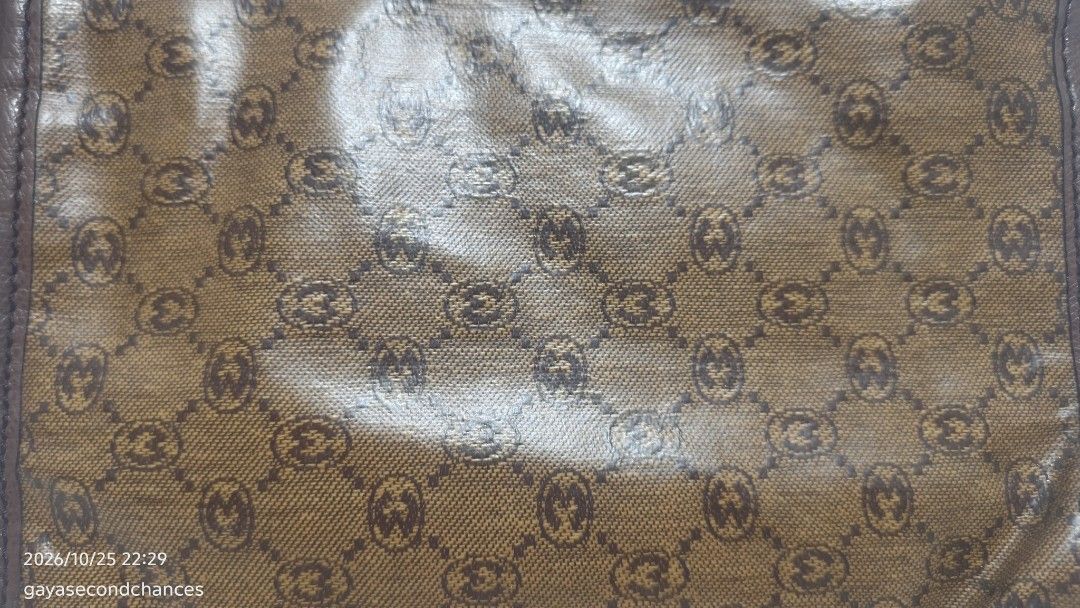 VINTAGE MORABITO PARIS MONOGRAM CLUTCH (Category: Belt bags, Clutches and Pouches) located in Kalibo. Submitted by secondchances.thriftsh8p (Listing ID 1470312950, Image 3). Description: - Brown patterned coated canvas with repeating monogram print - Dark brown leather trim and top zip closure - Convenient attached wrist strap for easy carrying - Compact size ideal for keys, cards, and lipstick - Great everyday or travel accessory.