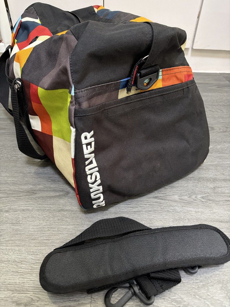 Vintage Quiksilver Duffel Bag (Category: Sling Bags) located in Manila. Submitted by hola.koala (Listing ID 1470212885, Image 2). Description: - Authentic - Spacious main compartment and convenient front zip pocket for easy organization - all zippers working - Includes a detachable black shoulder strap with a comfortable padded grip - Perfect size for gym sessions, sports gear, or weekend trips .