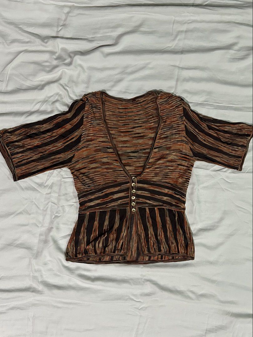 Vintage Striped V-Neck Blouse with Buttons (Category: Blouses) located in Muntinlupa City. Submitted by _gudstuff (Listing ID 1470223514, Image 1). Description: - Style: Retro brown and orange multi-tone striped blouse - Neckline: Deep V-neck with functional front buttons - Fits S to M.