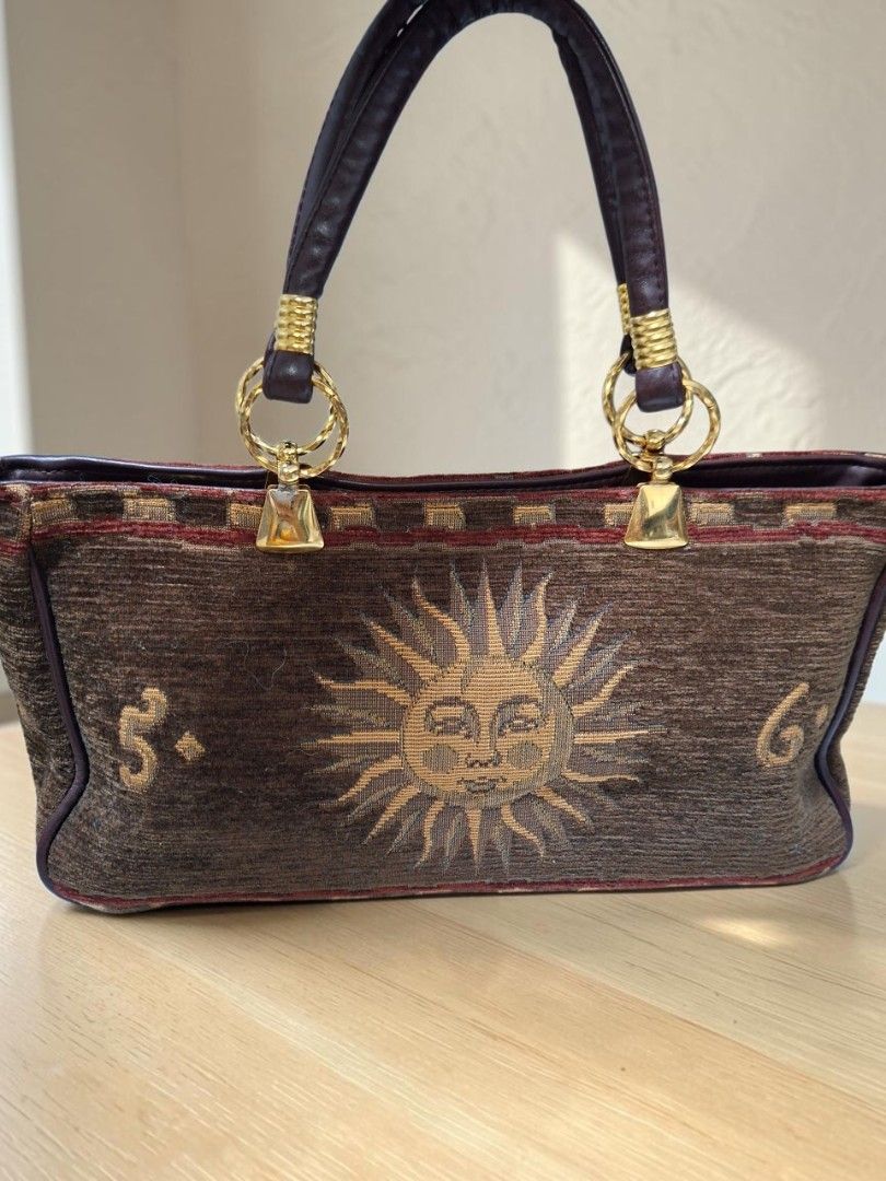VINTAGE TAPESTRY CELESTIAL SUN FACE DESIGN HANDBAG (Category: Tote Bags) located in Las Pinas. Submitted by annachiaonair2037 (Listing ID 1470302656, Image 2). Description: VINTAGE TAPESTRY CELESTIAL SUN FACE DESIGN HANDBAG FROM JAPAN TAPESTRY WITH LEATHER H 5.5" L 12" W 4".
