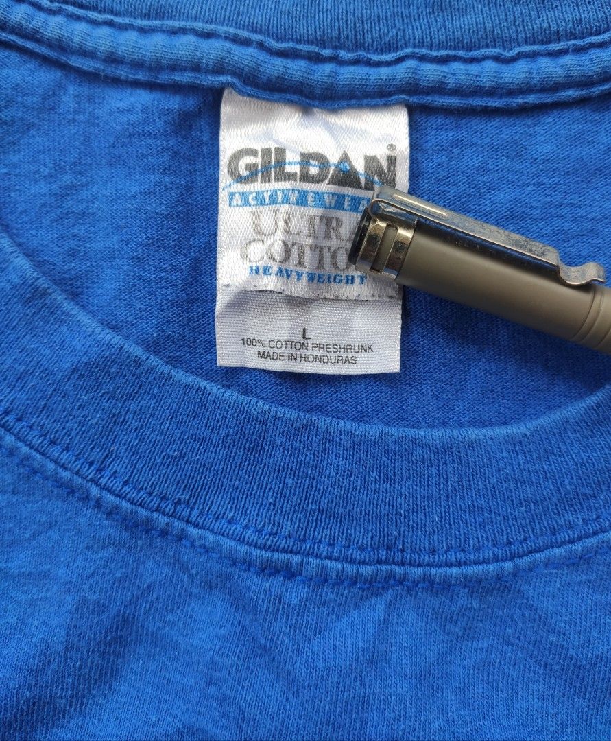 Vintage The Tick 2004 Graphic T-Shirt Blue Size L (Category: Tshirts & Polo Shirts ) located in Manila. Submitted by janablanks77380 (Listing ID 1470166708, Image 2). Description: - Official 2004 Benjamin Edlund The Tick graphic tee - Brand: Gildan Ultra Cotton tag, size Large 22 x 27.5 - Material: 100% preshrunk cotton for comfort - Color: Vibrant royal blue - Fit: Classic short sleeve, regular fit - Condition: Screen print shows minor vintage w