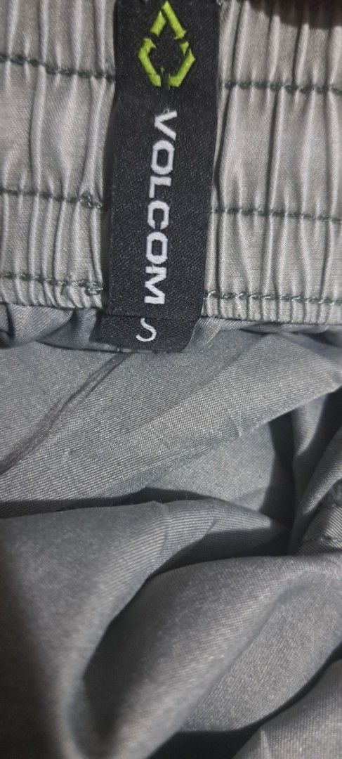 Volcom Grey Boardshorts Size S (Category: Swim Trunks & Board Shorts) located in San Fernando, Camarines Sur. Submitted by ladderaya (Listing ID 1470241116, Image 2). Description: - Brand/Model: Volcom grey shorts - Size: S - Waistband: Elastic with adjustable drawstring - Pockets: Convenient side pockets and one back pocket with Volcom True To This label - Details: Round Volcom logo patch near the bottom hem - Material: Lightweight fabric, ideal
