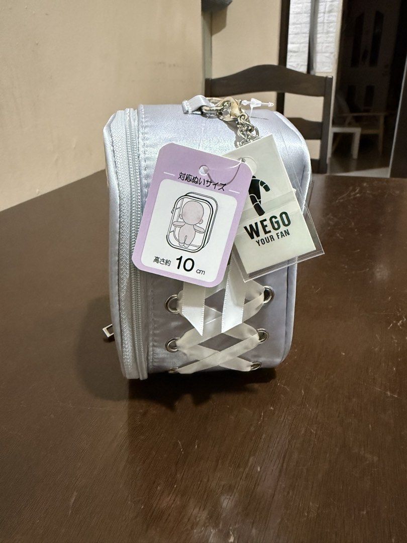WEGO Your Fan Doll Storage Bag Silver 10cm (Category: Accessory Holder, Box & Organizers) located in Pasig City. Submitted by boredtakoyaki (Listing ID 1470247233, Image 1). Description: - Brand: WEGO - Color: Silver - Size: Fits 10cm plush dolls - Features: Clear front window & white ribbon corset lacing on the side - Inclusion: Top keychain attachment for easy hanging - Condition: Brand new with original store tags attached.