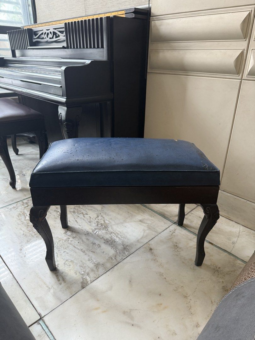Weinstein & Sons Upright Piano with extra Bench (Category: Musical Instruments) located in Manila. Submitted by korprincess (Listing ID 1470347996, Image 3). Description: - Brand/Model: Vintage Weinstein & Sons upright piano - Finish: Dark wood with classic cabinet design, decorative carved legs, and front panel fluting - Inclusions: Matching piano bench with blue upholstered seat - Condition: Good for practice or home decor; needs tuning and min
