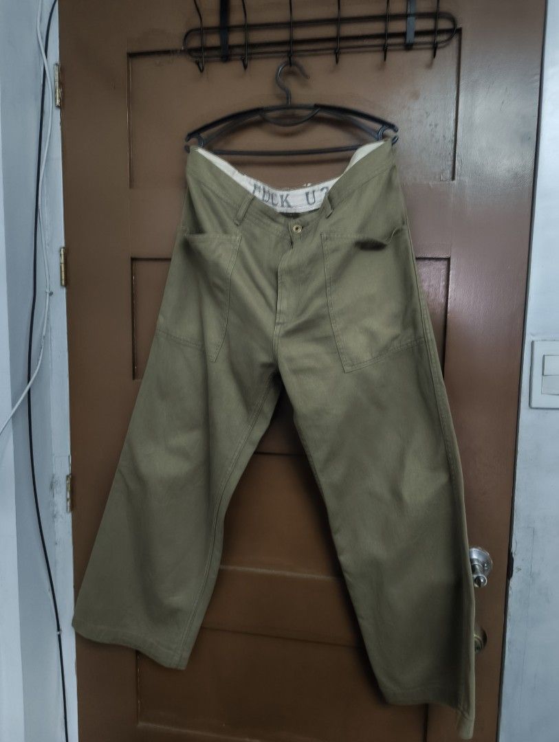 Weirdo Utility Pants (Category: Jeans) located in San Pedro. Submitted by madvillainkicks (Listing ID 1470152772, Image 2). Description: - Brand/Model: Glad Hand & Co. Weirdo Utility Pants - Color: Olive Green - Size: XL - Material: 85% cotton, 15% linen blend (body and lining) - Origin: Made in Japan - Fit: Relaxed wide leg with vintage military workwear aesthetic - Details: Front and back patch pockets, secret 'FUCK U?' graphic printed on the i