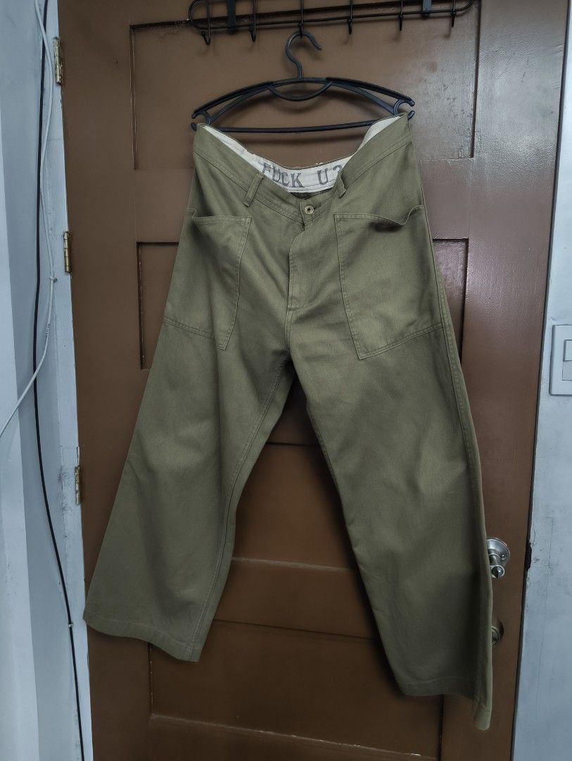 Weirdo Utility Pants (Category: Jeans) located in San Pedro. Submitted by madvillainkicks (Listing ID 1470152772, Image 1). Description: - Brand/Model: Glad Hand & Co. Weirdo Utility Pants - Color: Olive Green - Size: XL - Material: 85% cotton, 15% linen blend (body and lining) - Origin: Made in Japan - Fit: Relaxed wide leg with vintage military workwear aesthetic - Details: Front and back patch pockets, secret 'FUCK U?' graphic printed on the i