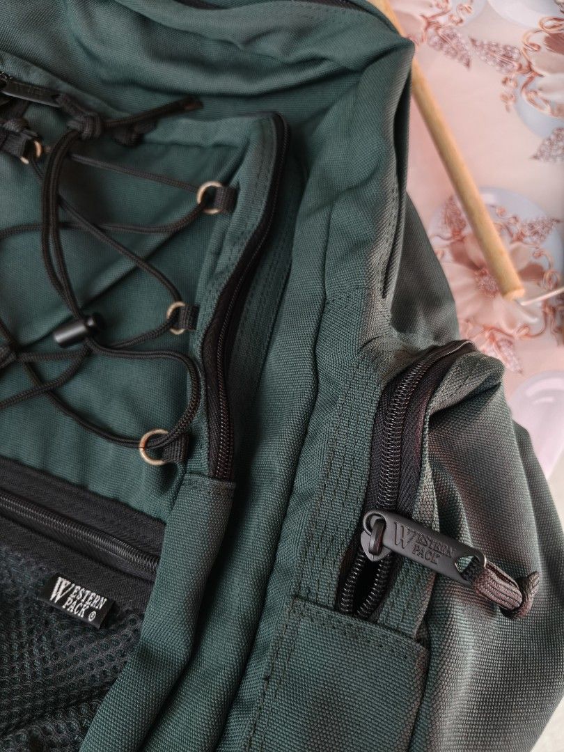 Western Pack Green Multi-Compartment Hiking Travel Backpack (Category: Backpacks) located in Binan City. Submitted by makinpeso0622 (Listing ID 1470183305, Image 3). Description: - Durable green Western Pack multi-compartment backpack for hiking and travel - Built tough with heavy-duty nylon or canvas construction - Secure bungee cord front lacing system for extra gear - Convenient mesh utility pockets on the front and sides - Multiple zippered c