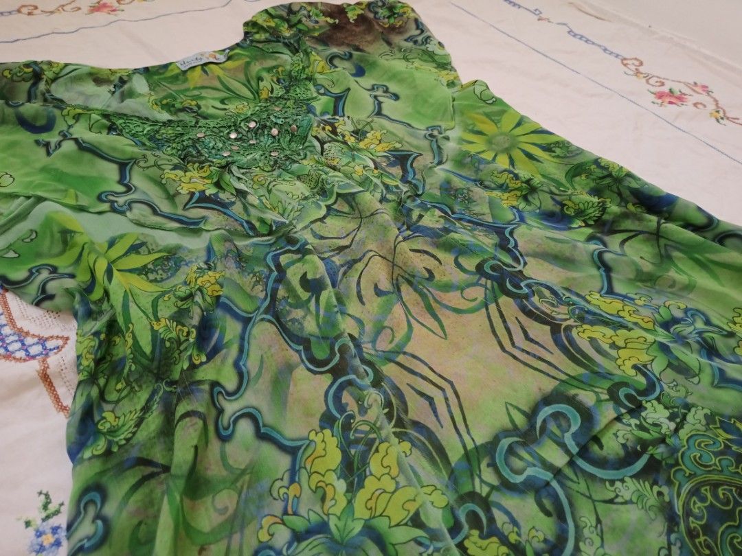 whimsy green top flowy (Category: Blouses) located in Binan City. Submitted by shayclothies_ (Listing ID 1470262554, Image 2). Description: 🍄 xs - m 🍄 no issues/flaws 🍄 flowy and sheer in the under part !.