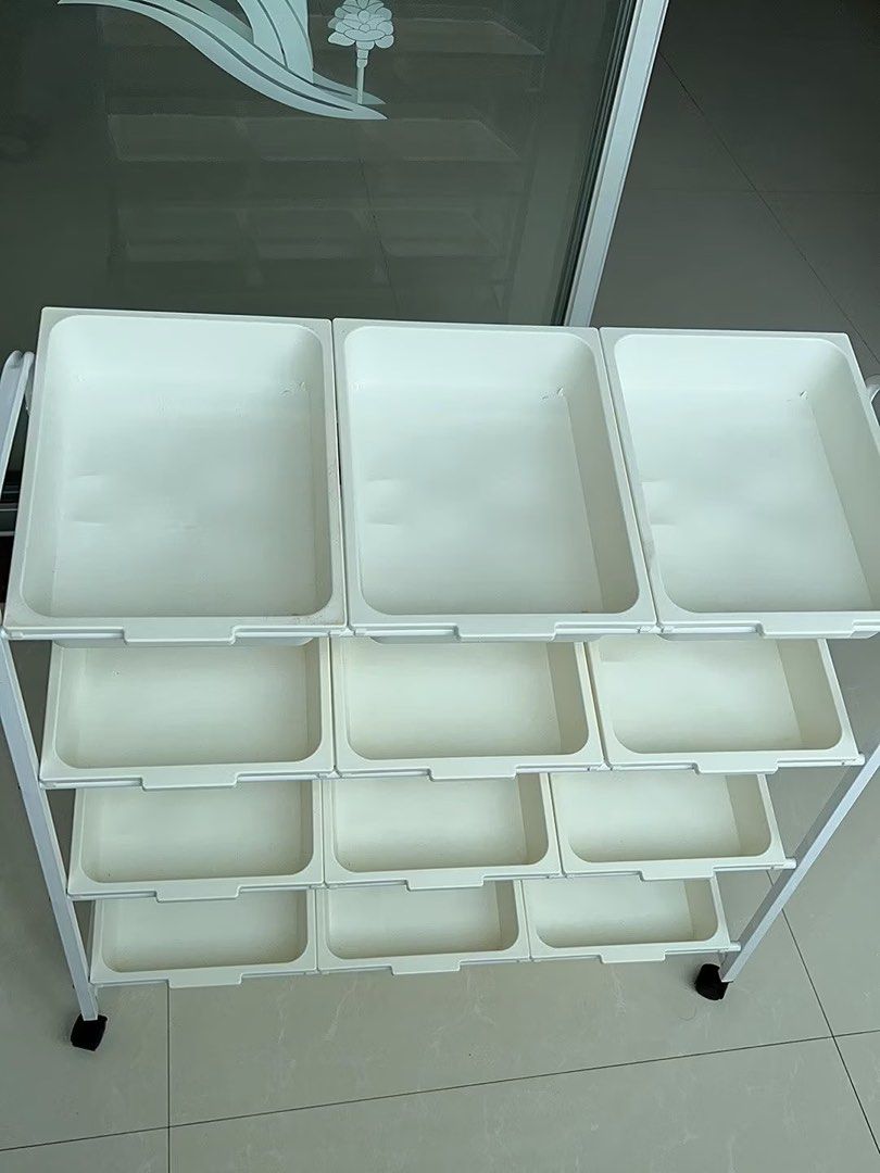 White 4-Tier Rolling Storage Cart with Plastic Bins (Category: Educational & Learning Toys) located in Rodriguez. Submitted by anjloving (Listing ID 1470290693, Image 1). Description: - 4-tier rolling storage cart with smooth-sliding plastic bins - Sturdy white metal frame built for everyday use - 4 caster wheels for easy mobility around the house - Multi-purpose: great for toys, craft supplies, office gear, or kitchen items - Compact design help