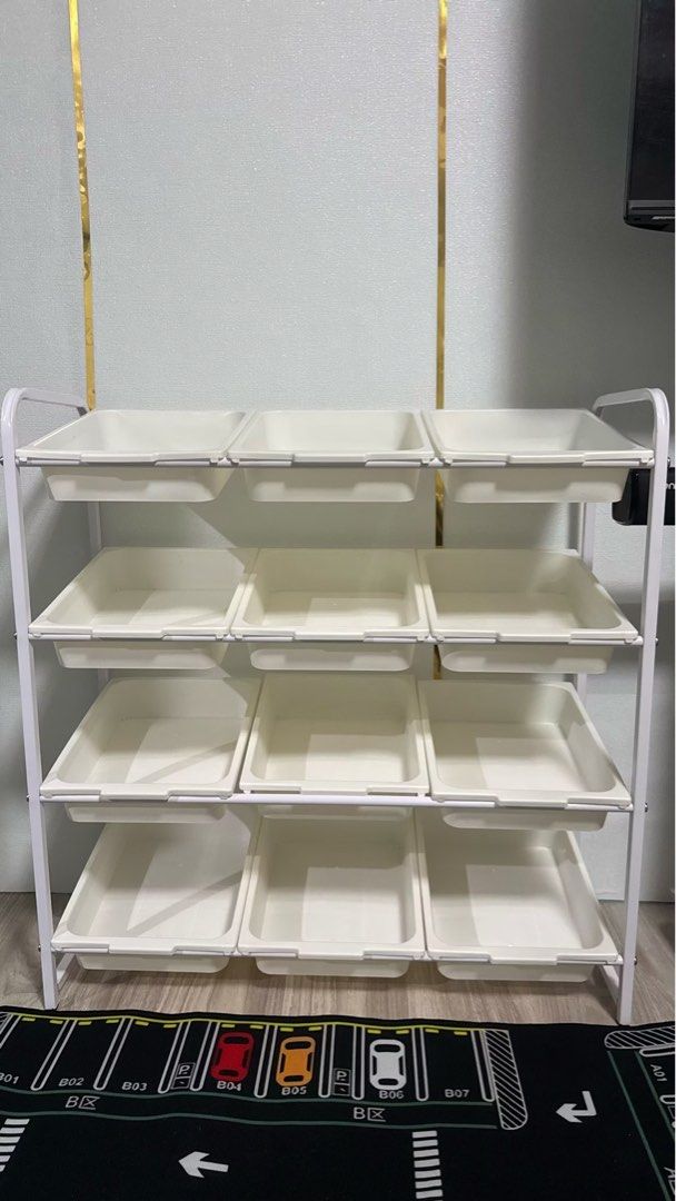 White 4-Tier Rolling Storage Cart with Plastic Bins (Category: Educational & Learning Toys) located in Rodriguez. Submitted by anjloving (Listing ID 1470290693, Image 3). Description: - 4-tier rolling storage cart with smooth-sliding plastic bins - Sturdy white metal frame built for everyday use - 4 caster wheels for easy mobility around the house - Multi-purpose: great for toys, craft supplies, office gear, or kitchen items - Compact design help