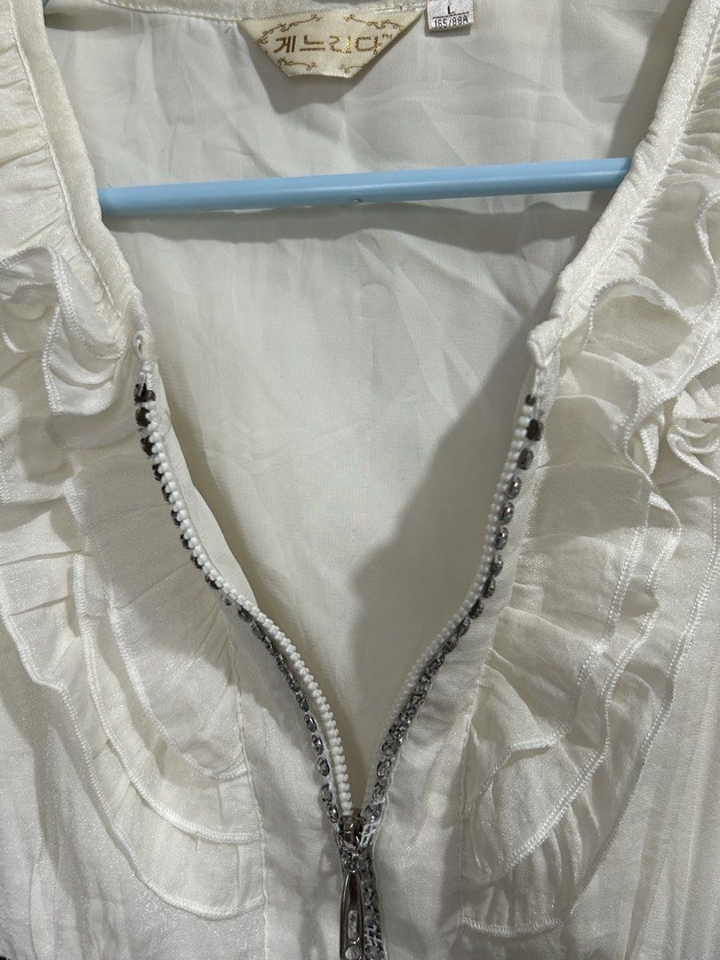 White and Black Gingham Ruffle Dress (Category: Dresses) located in Pasig City. Submitted by eddwuhrd (Listing ID 1470167462, Image 3). Description: - Style: Short sleeve dress with white ruffled top and black-and-white gingham skirt - Closure: Half-zip front with sparkling rhinestone details along the zipper teeth - Design: High waist cut with decorative button accents down the front - Size: L (165/88A) - Condition: Excellent, ready to wear.